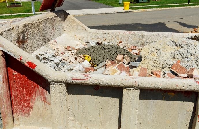 construction dumpster filled with debris
