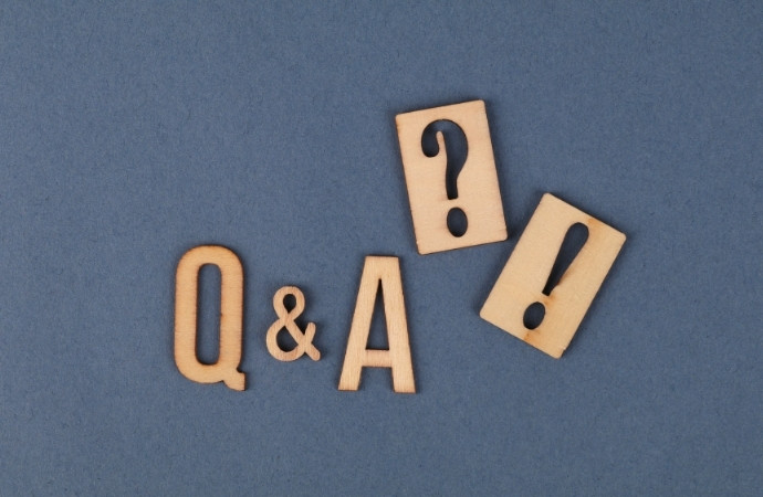 q and a letters written in light brown color
