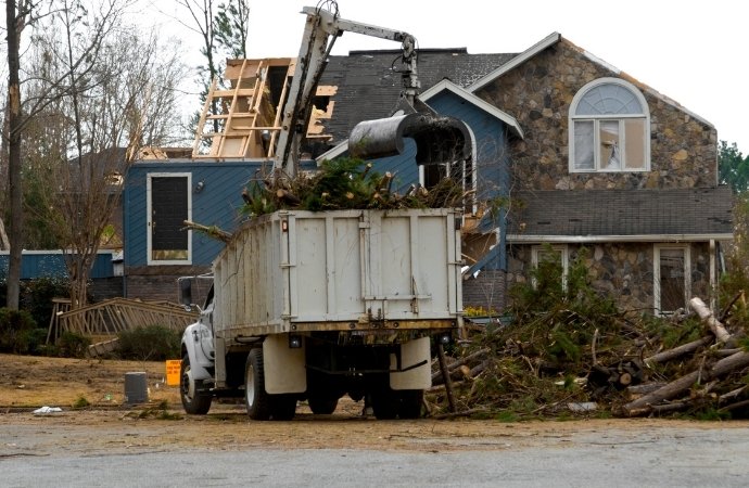 wood in a dumpster truck