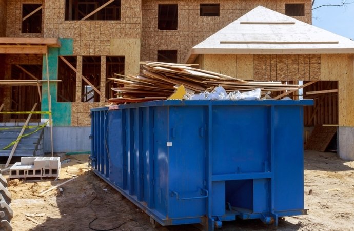 blue container filled with recycled trash in hondo