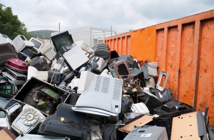 electronic wastes in a dumpster