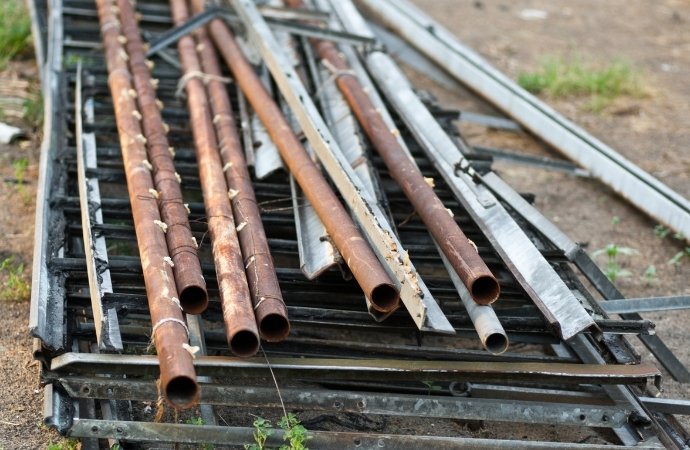 pipe and metal scraps for dumpster hauling