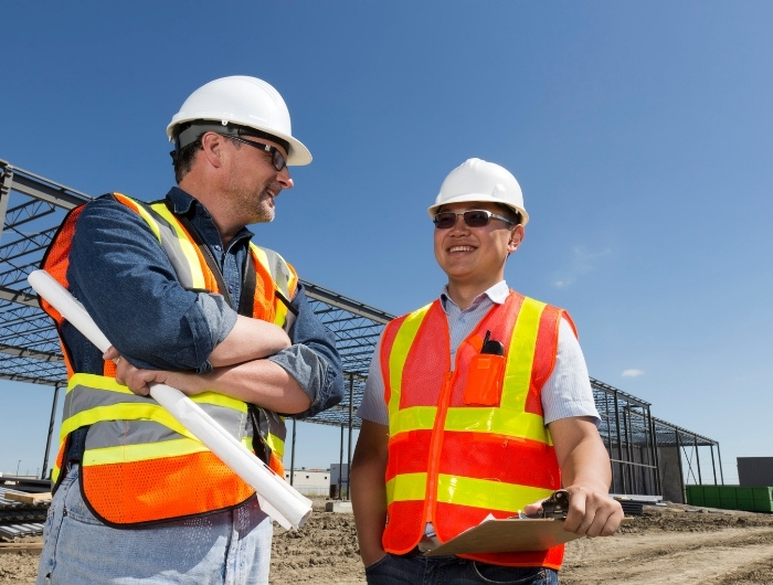 contractor talking to a waste hauler
