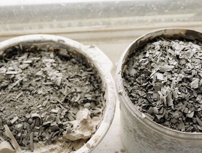 two pails full of construction debris