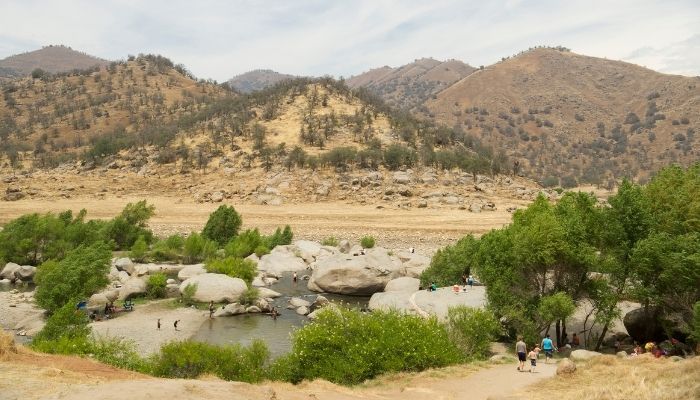 people enjoying the river at three rivers tx