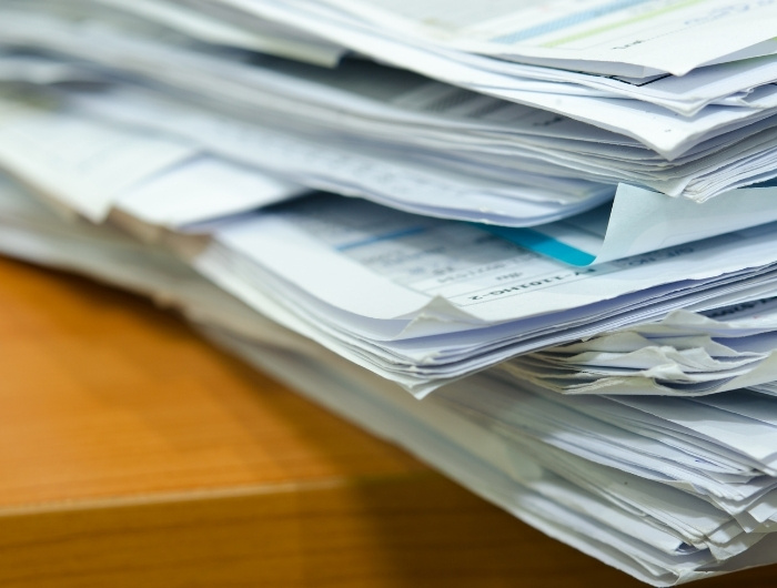 pile of permit documents in a table
