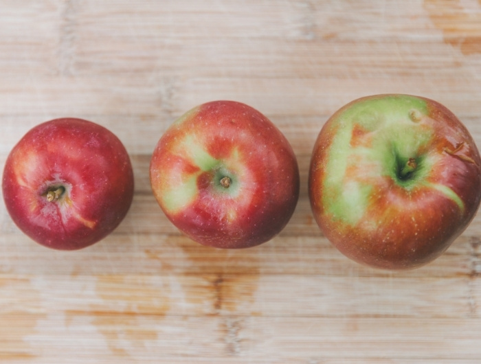 three different apple sizes