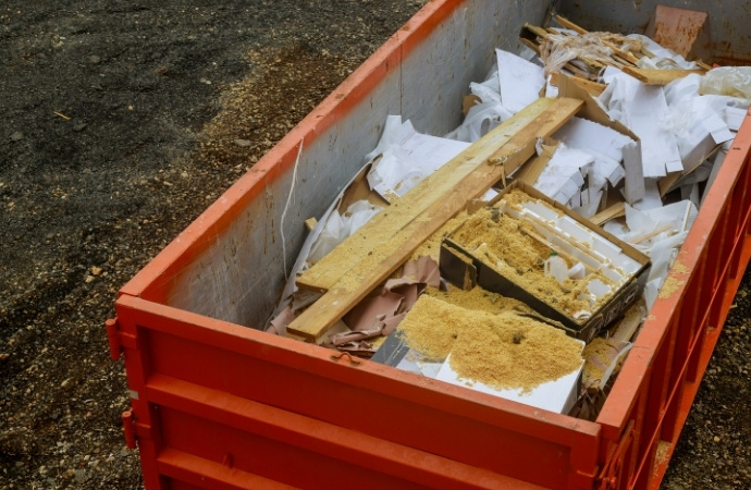 red container full of constuction debris