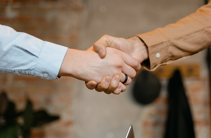 two people handshaking after contract deal